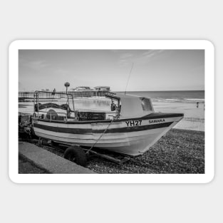 Traditional fishing boat on Cromer beach with the Victorian pier in the background Sticker